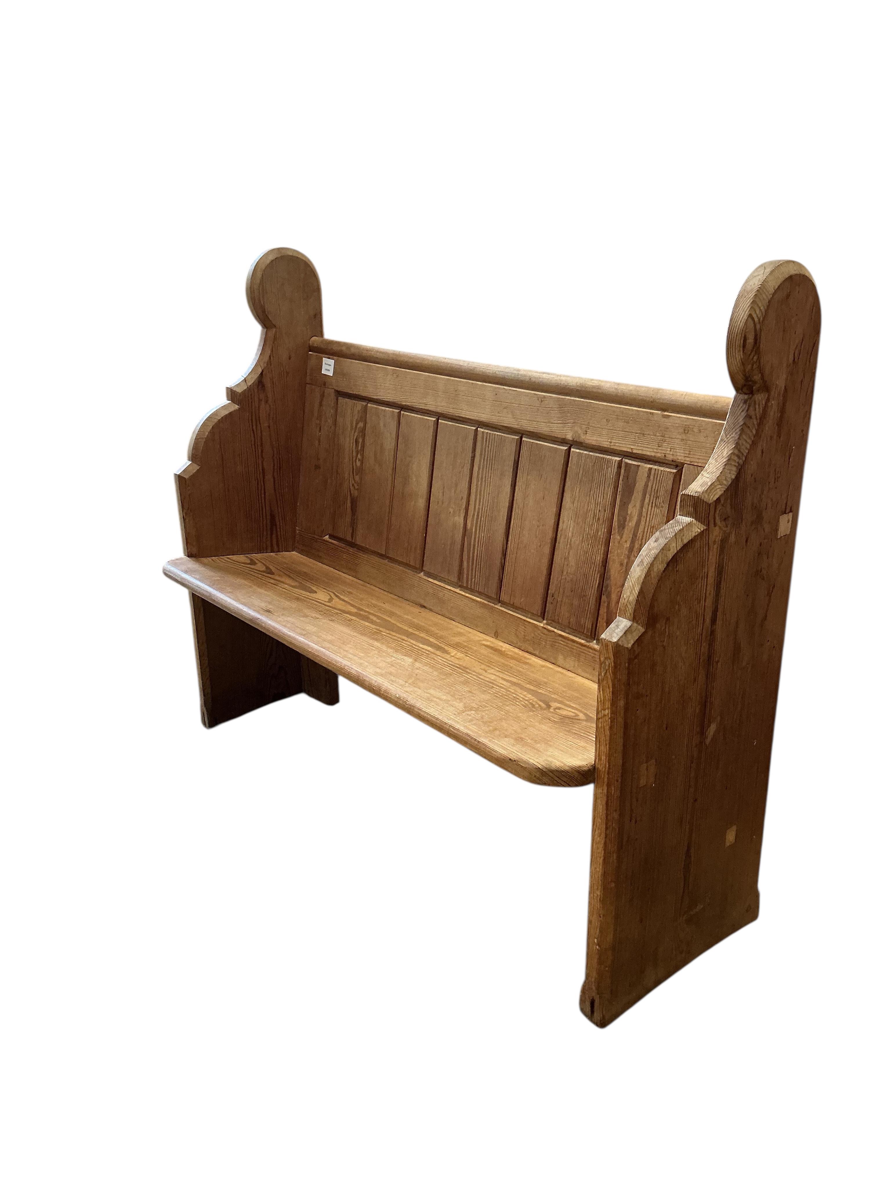 A small Victorian panelled pitch pine pew, width 119cm, depth 40cm, height 99cm